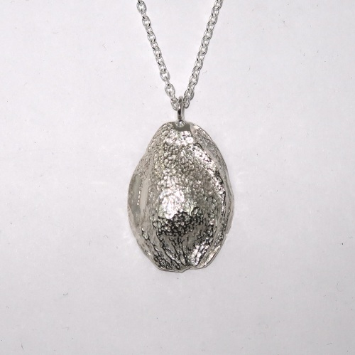 Solid silver apricot seed pendant